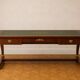 Empire-style centre desk in mahogany – with side pull-outs