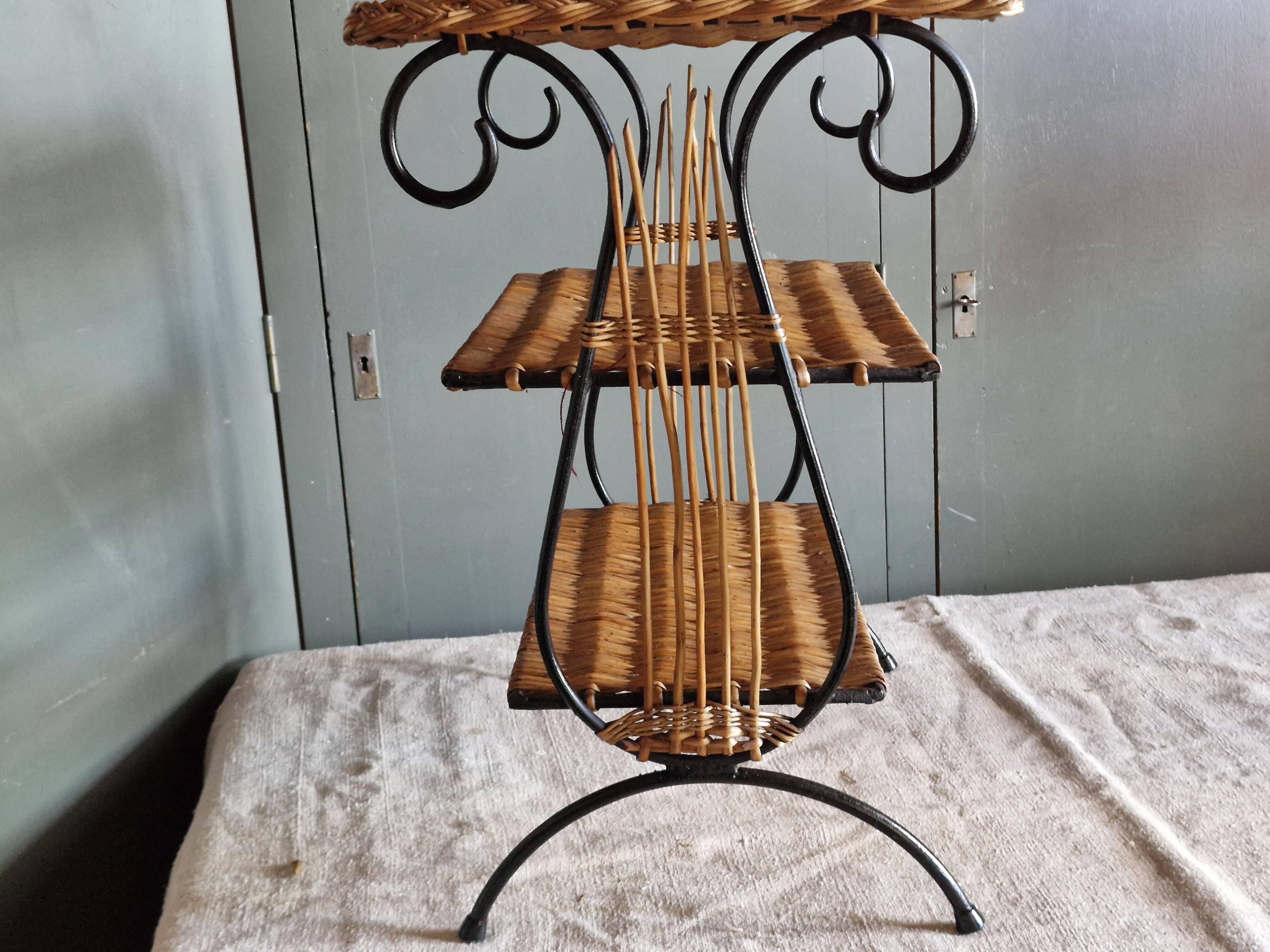 Small antique piece of furniture from the 1960s made of rattan and wrought iron in the shape of a lyre.
