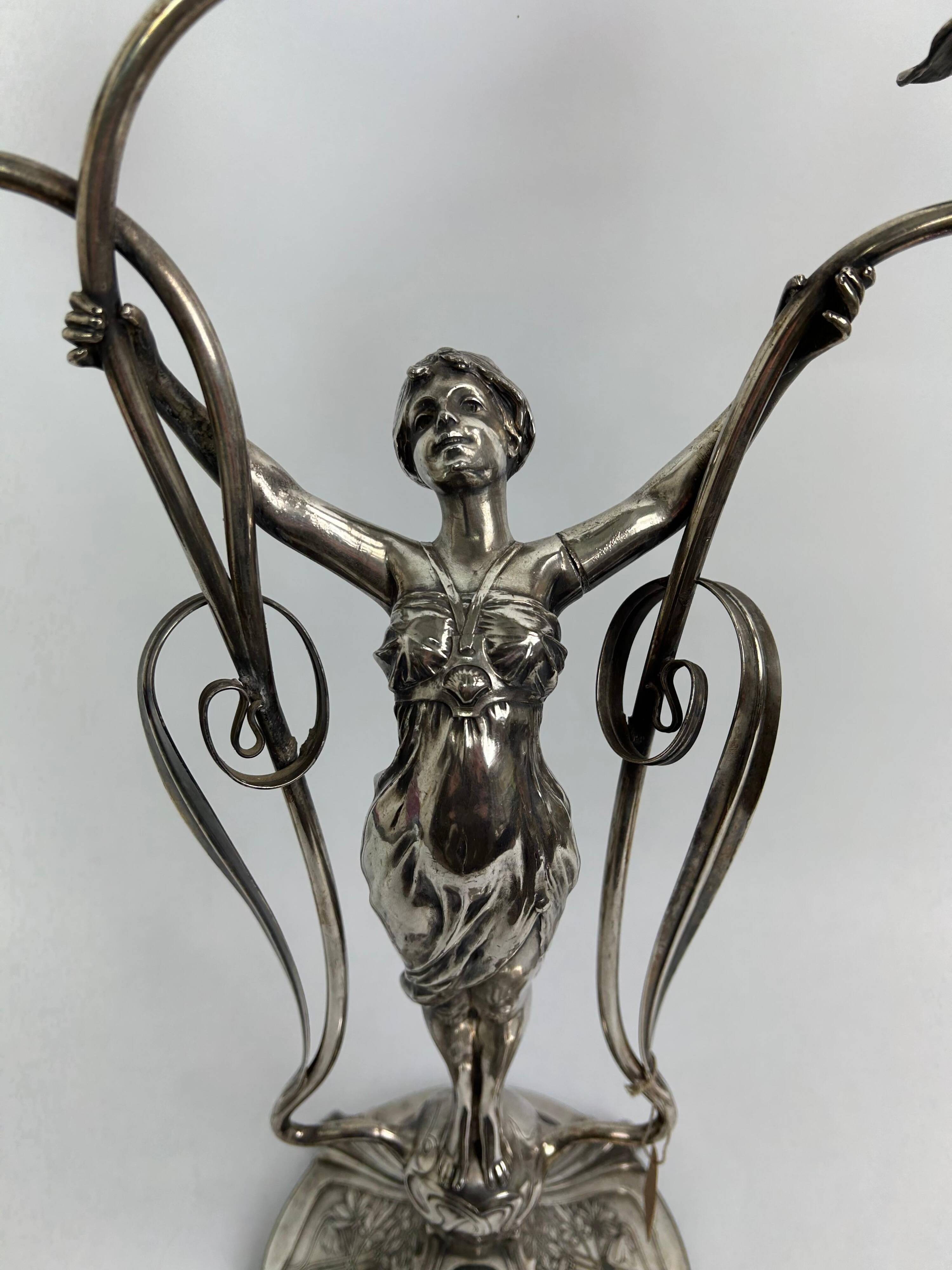 Large figurative chandelier with a femme fatale nymph.