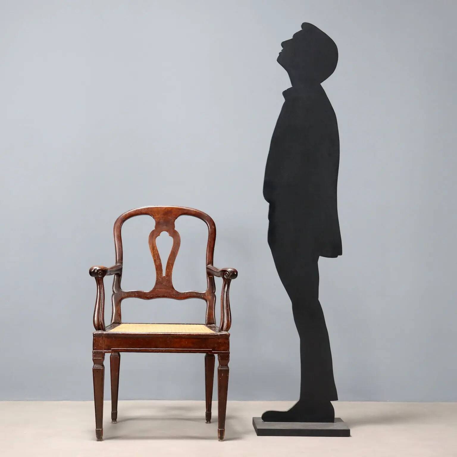 Antique walnut armchair with caned seat, Italy, 18th century