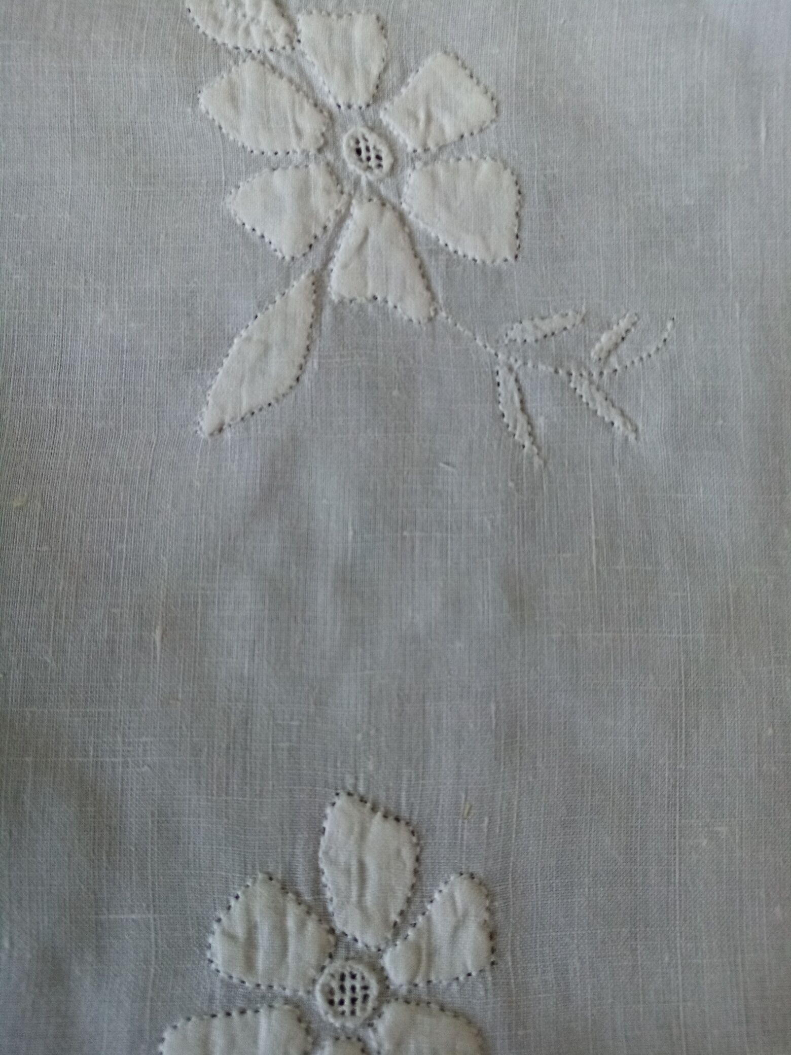 Antique white tablecloth embroidered with flowers and matching napkins