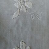Antique white tablecloth embroidered with flowers and matching napkins