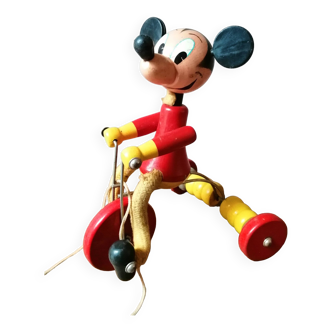 Old Mickey Mouse toy on his wooden tricycle