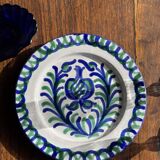 Artesania Alvarez Spanish plate in terracotta with blue plant motif.
