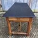 Antique oak farmhouse table with cat bar and 2 end drawers