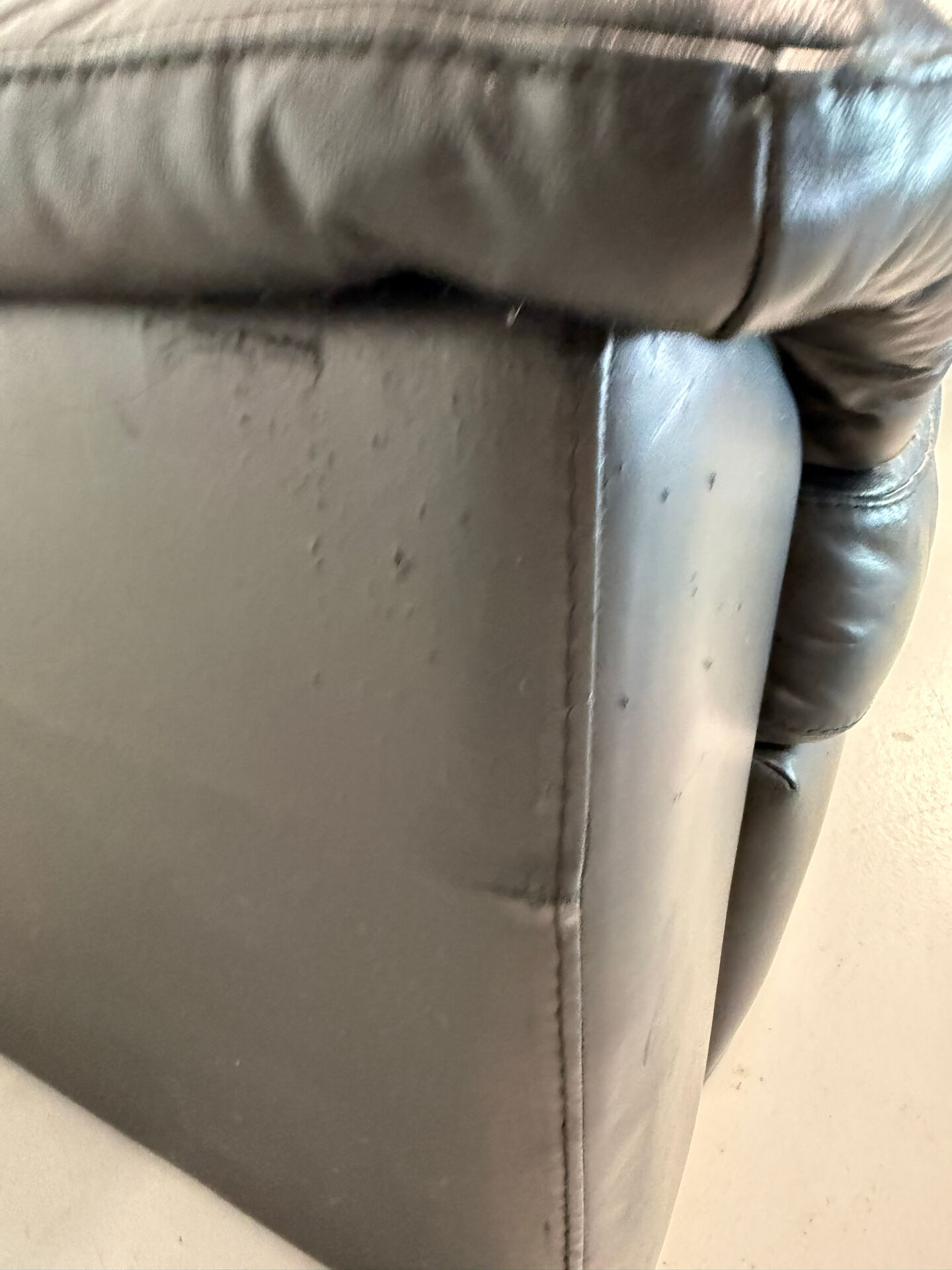 Two-seater black leather sofa — postmodern design