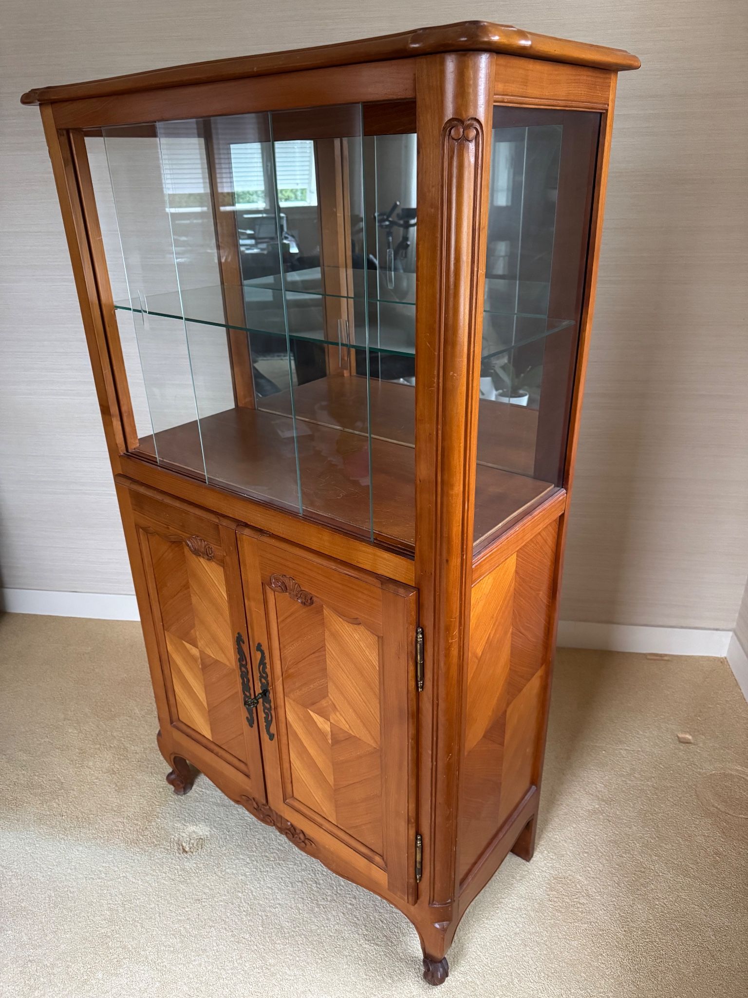 Louis XV style display cabinet, glass doors and chevron panels.