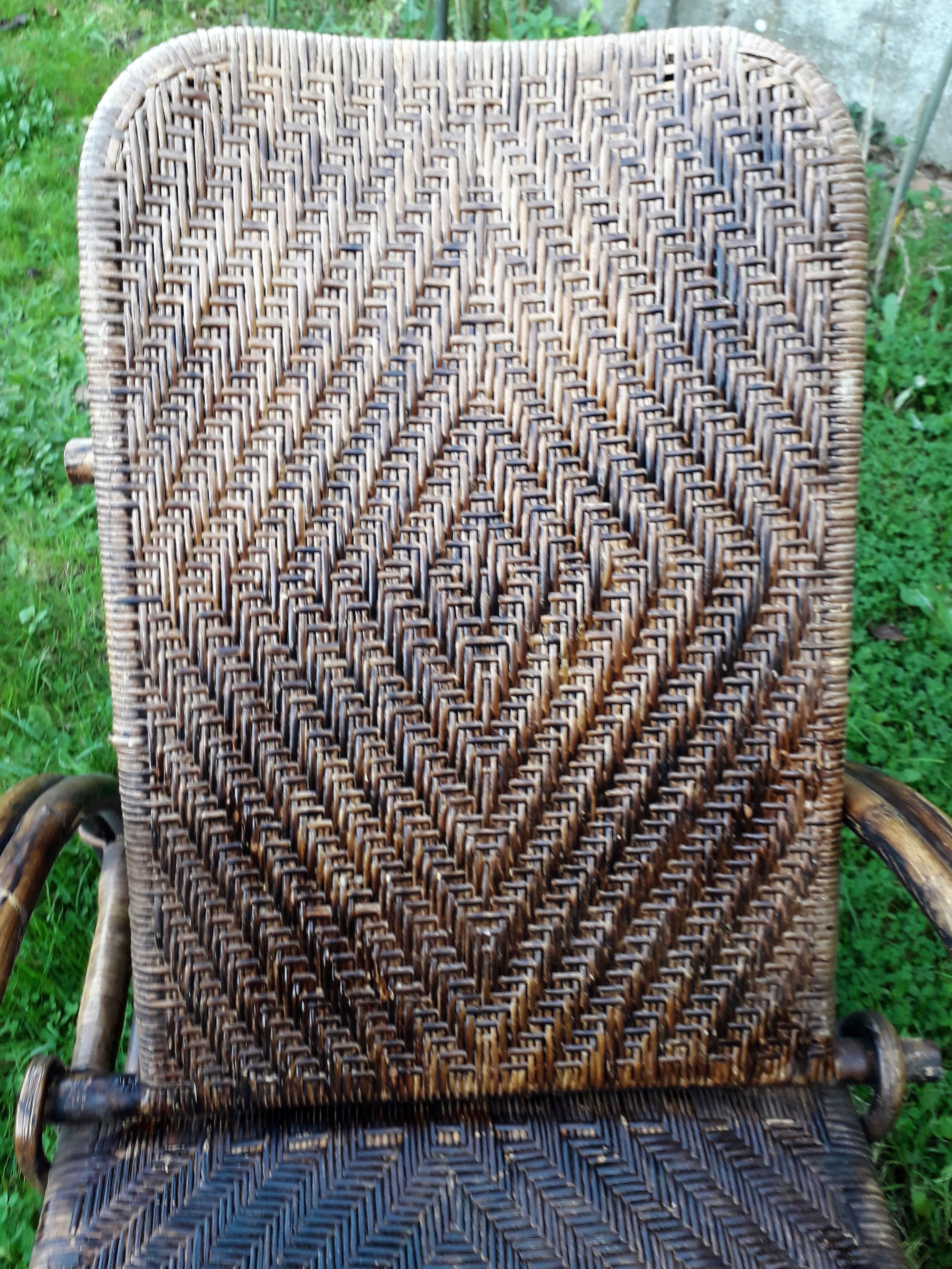 Armchair in rattan with rest foot 60s