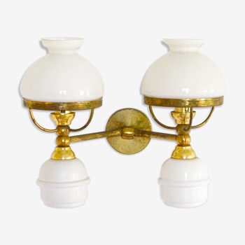A double brass and opaline wall light