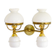 A double brass and opaline wall light