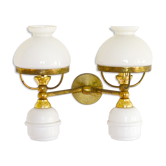 A double brass and opaline wall light