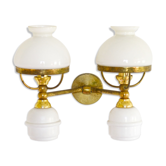 A double brass and opaline wall light