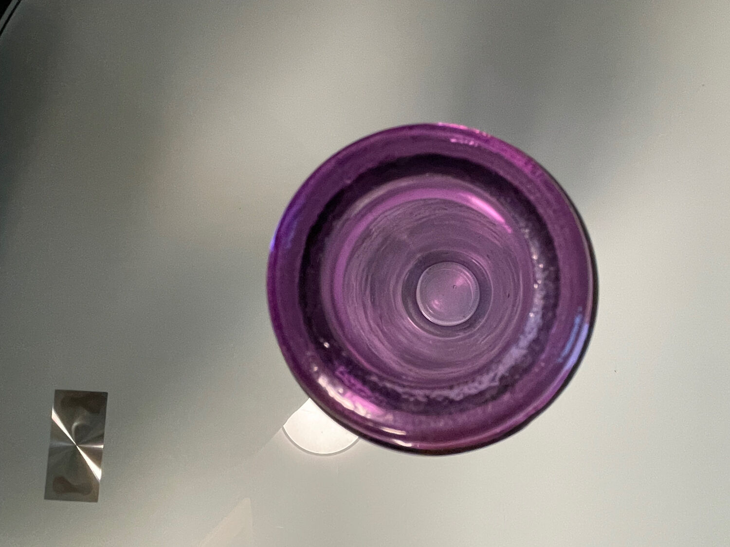 Ancient violet glass soliflore. Apothecary spirit.
