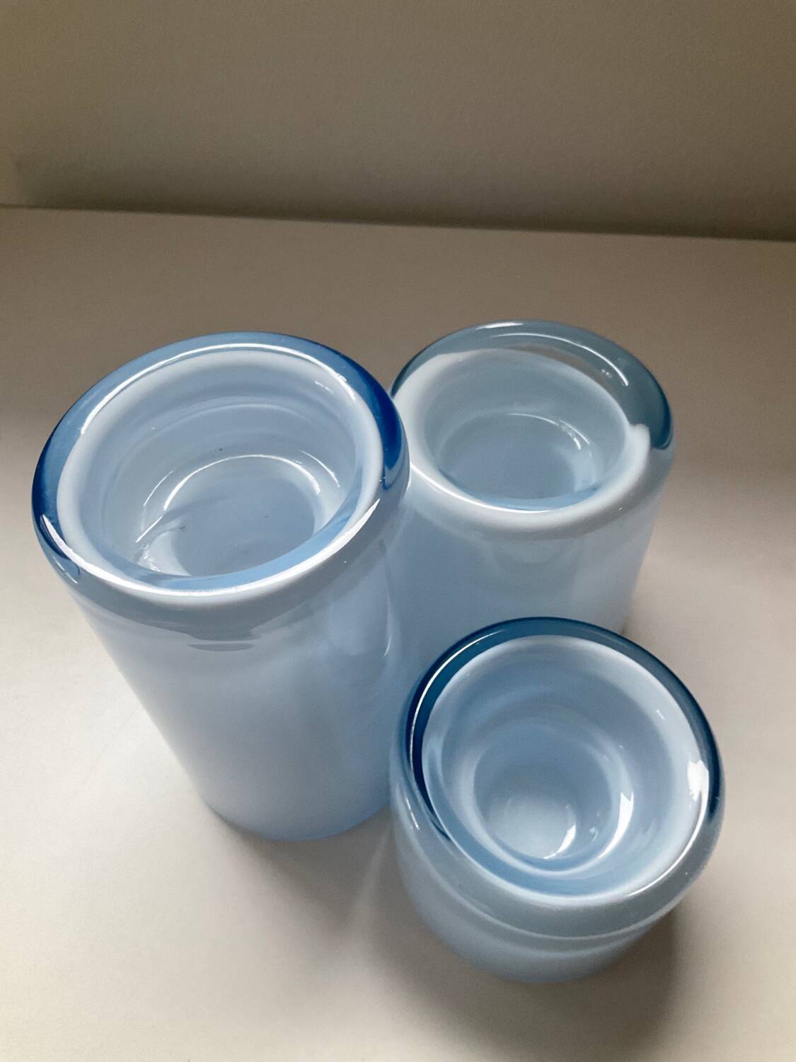 Trio of vintage candlesticks in double-layer glass paste