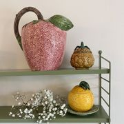 Set of ceramic fruits, a strawberry decanter and two lemon and pineapple jam jars