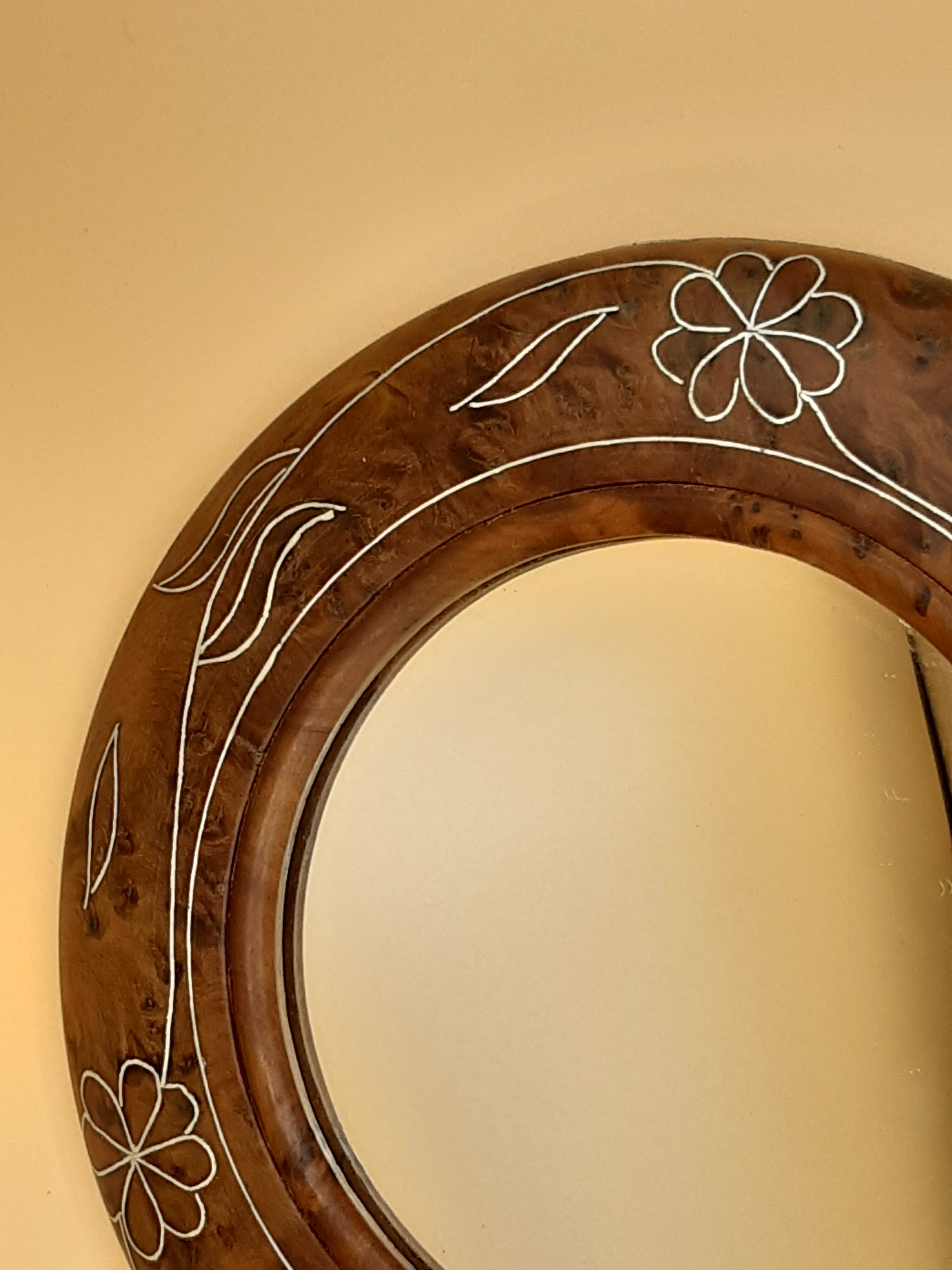 Antique mirror on wooden stand and metal net