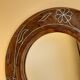Antique mirror on wooden stand and metal net