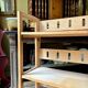 Folding bookshelf in light wood.