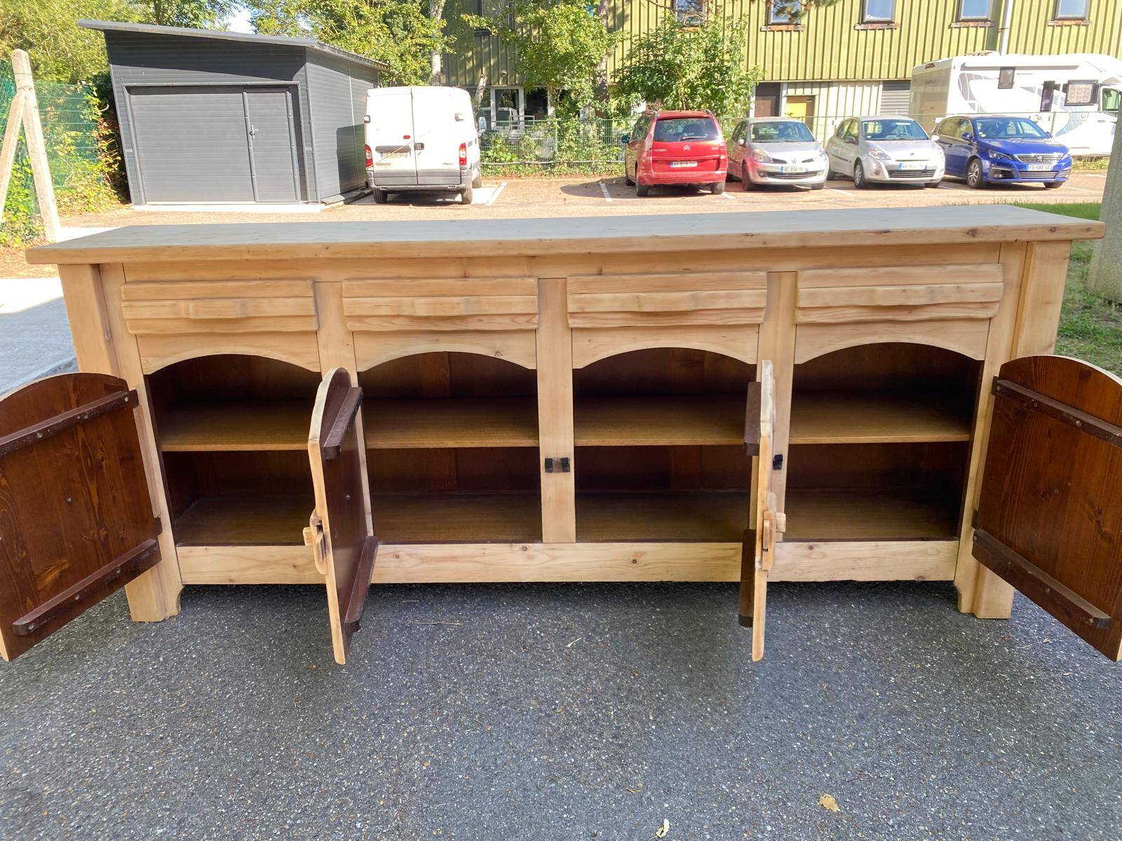 Row of renovated light solid wood chalets from the 1970s.