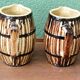Pair of trompe l'oeil bistro pitchers, barrels