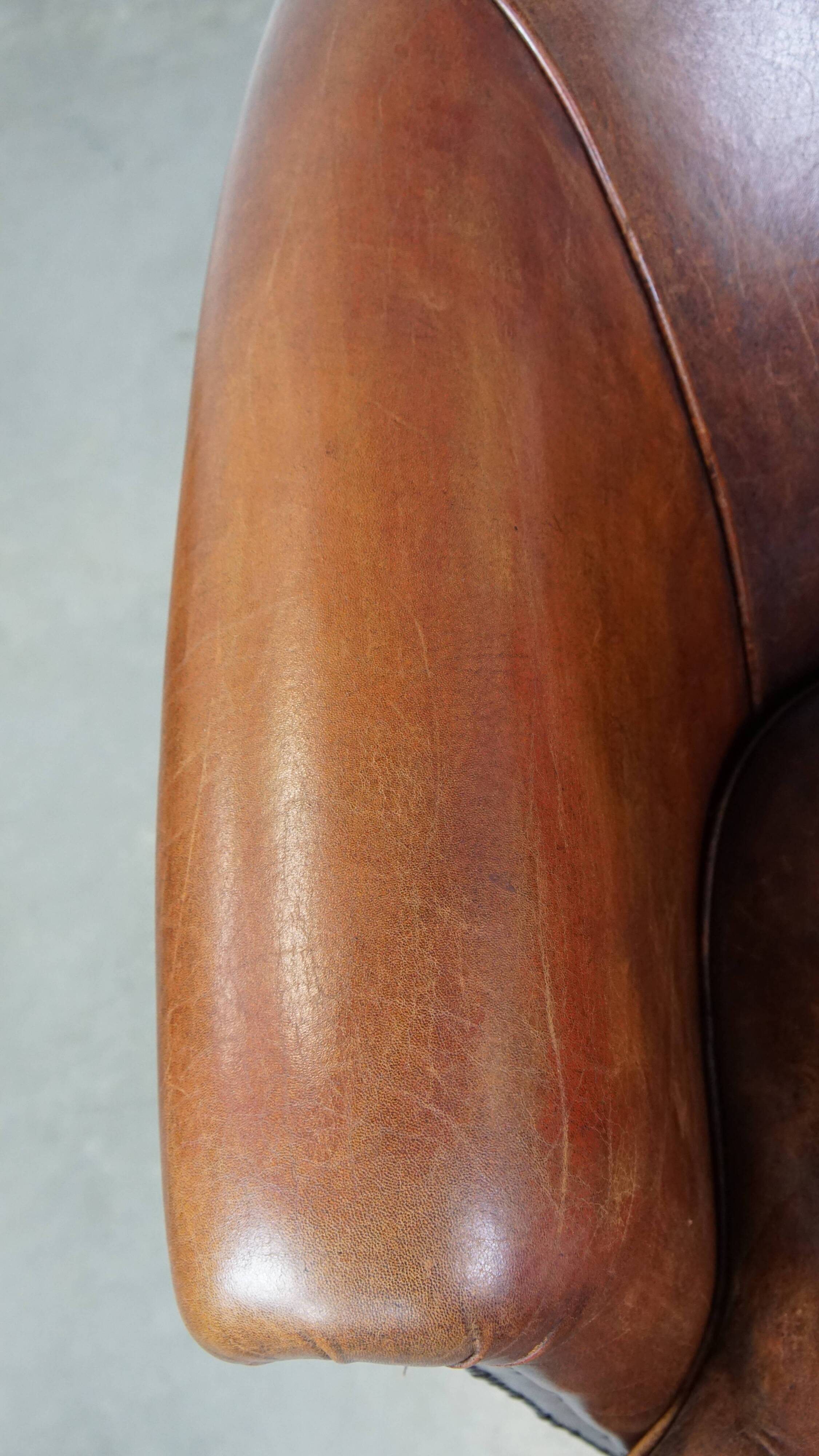 Cognac-colored sheepskin leather club chair
