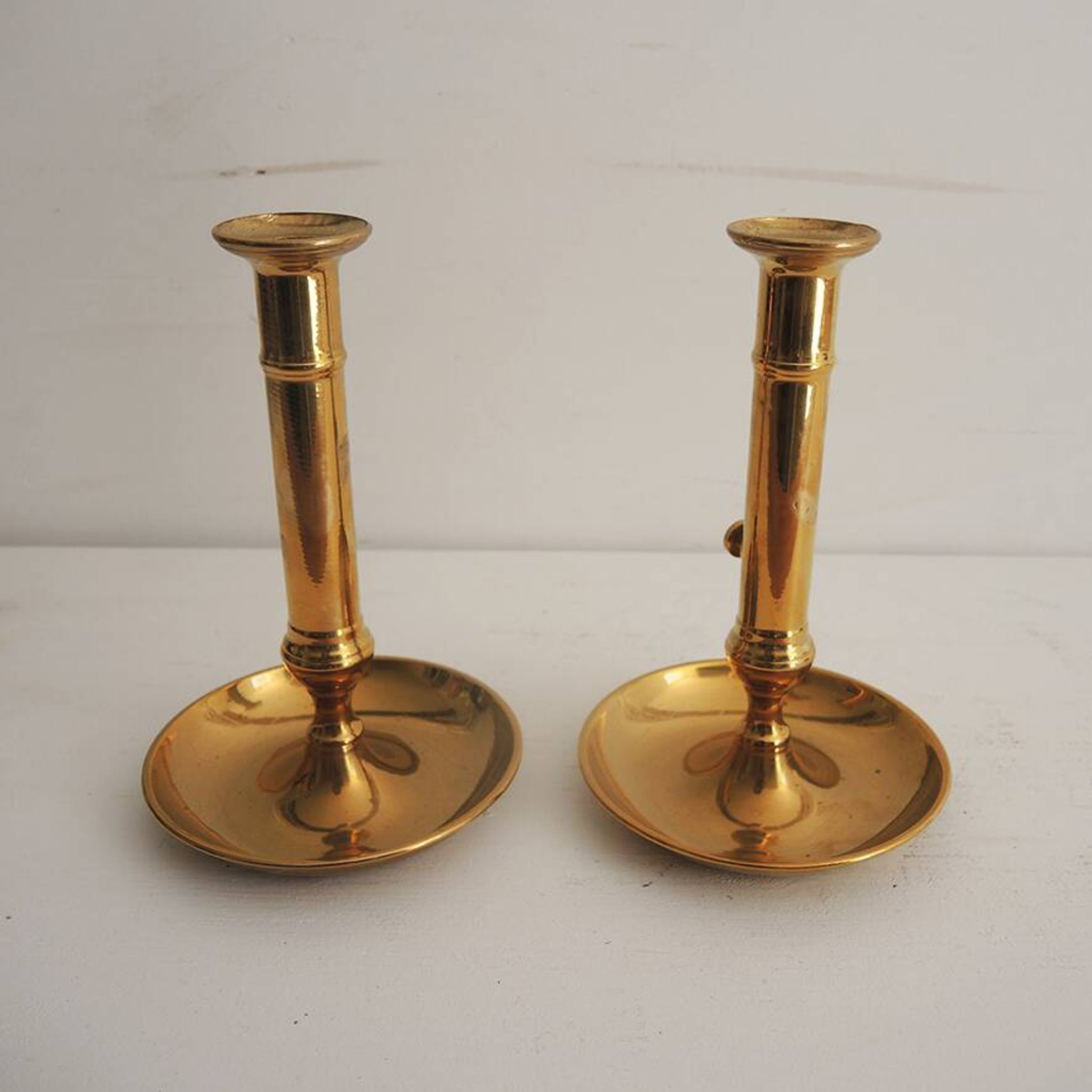 2 antique brass push candle holders