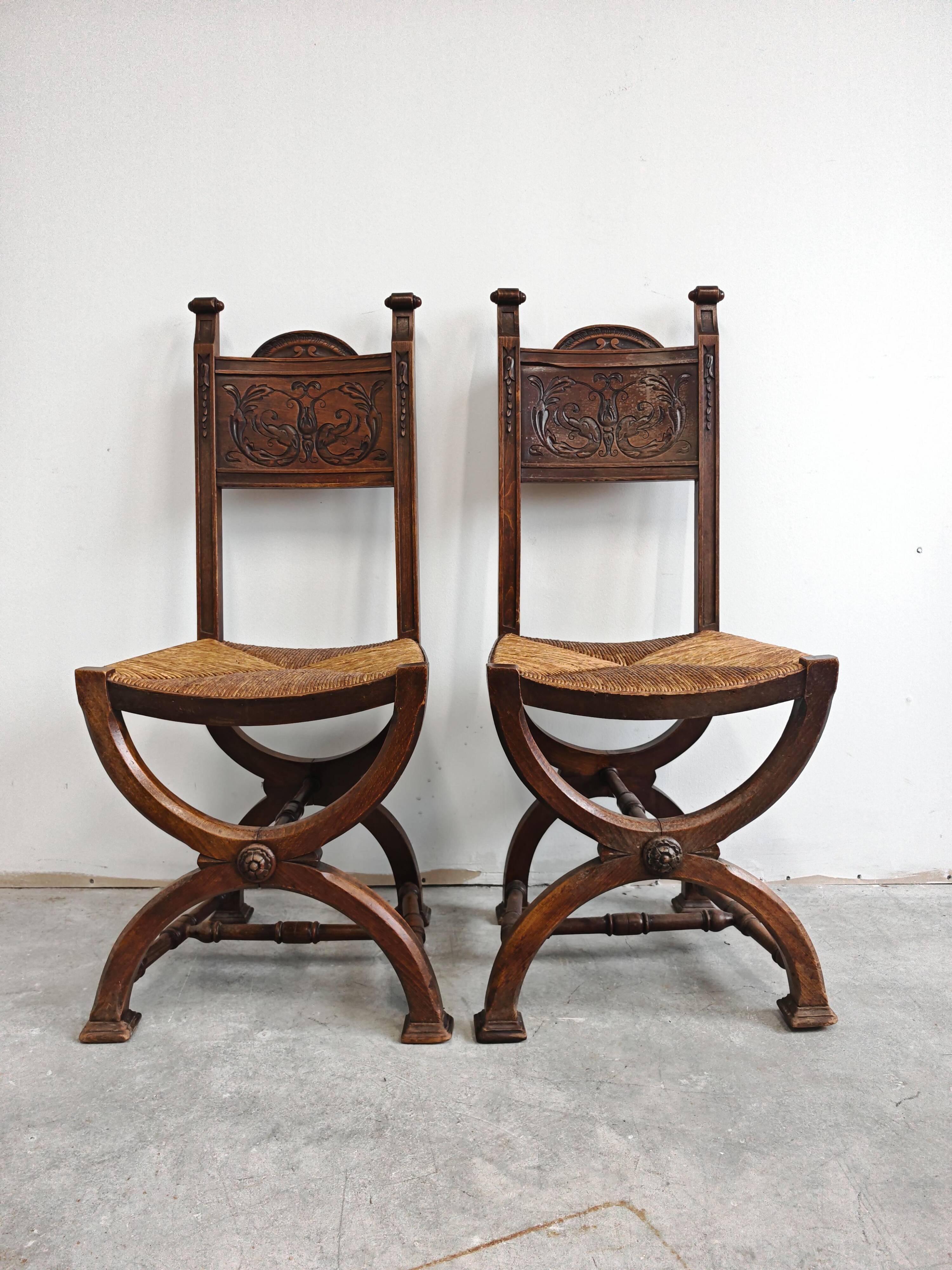 Pair of Neo-Renaissance oak chairs with straw seats, 1910