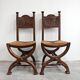 Pair of Neo-Renaissance oak chairs with straw seats, 1910