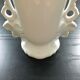 White vase flowery handles