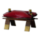 Moroccan stool in the shape of a camel saddle, stained wood, brass and leather, North Africa, 1980.