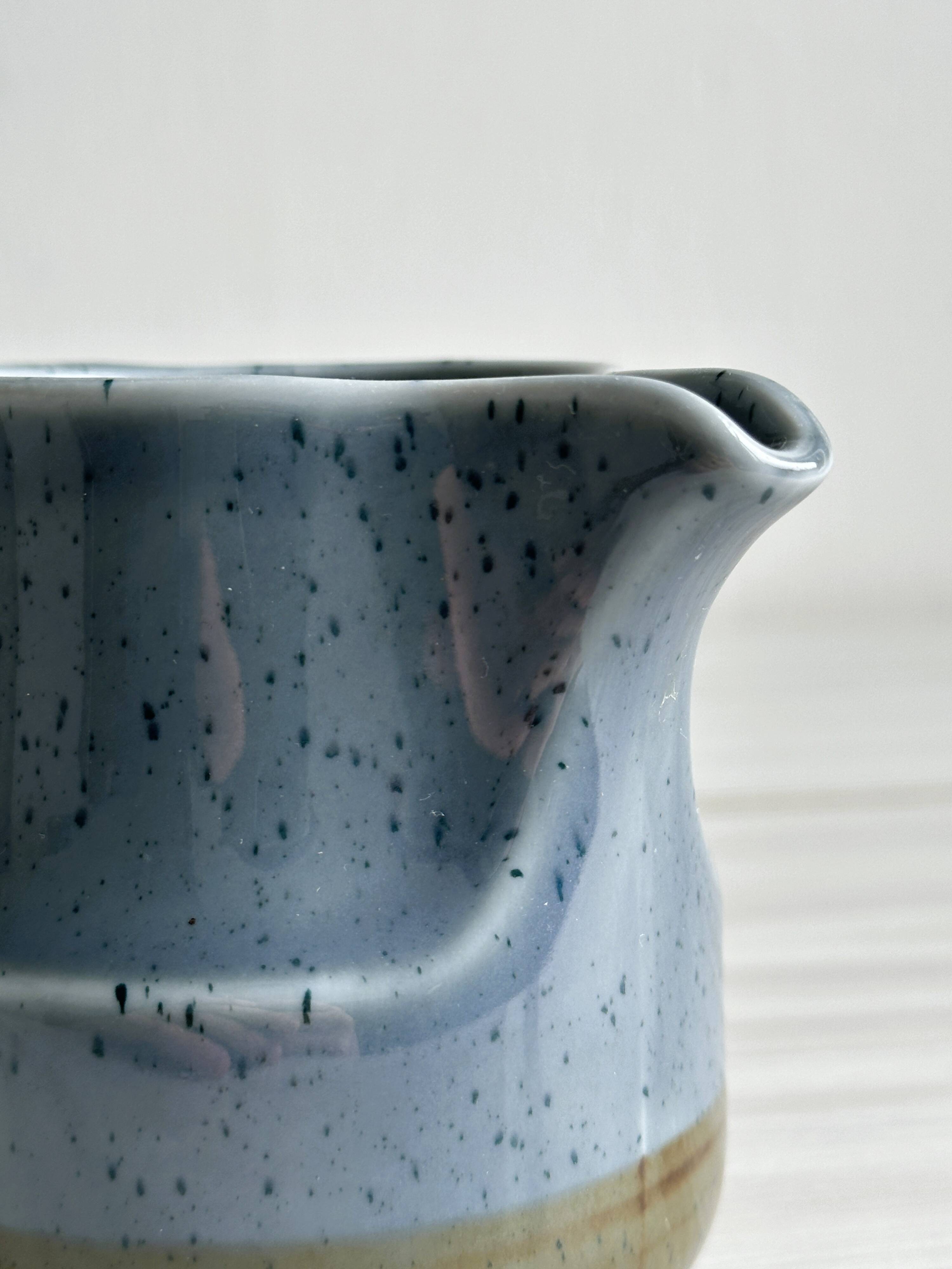 Blue and beige ceramic milk jug