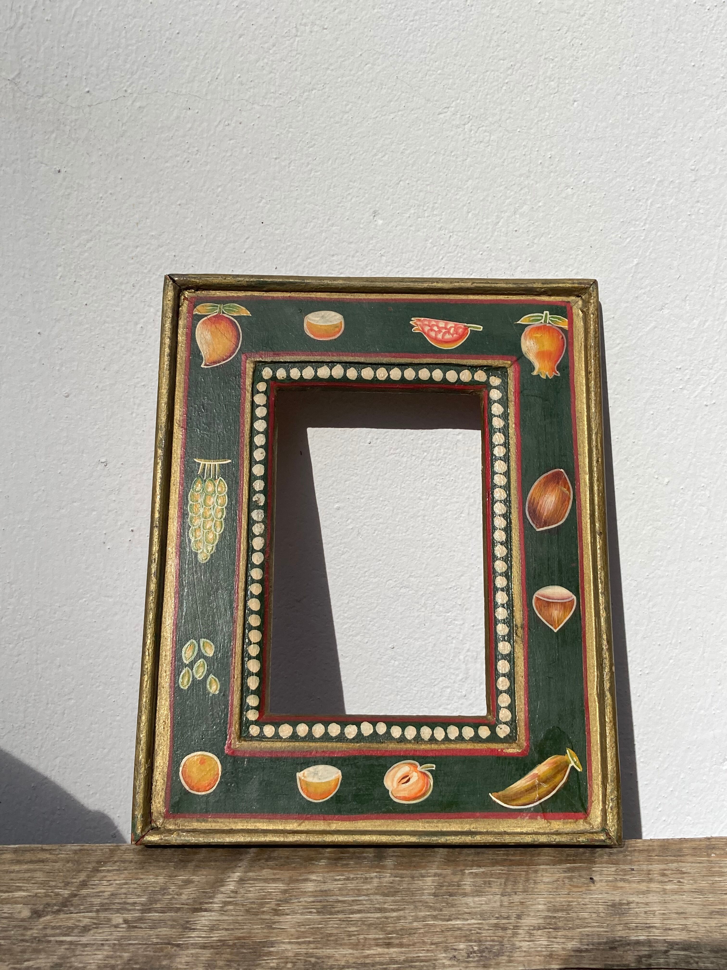Hand-painted wooden frame with fruit decoration