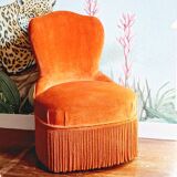 Velvet toad armchair and orange fringes