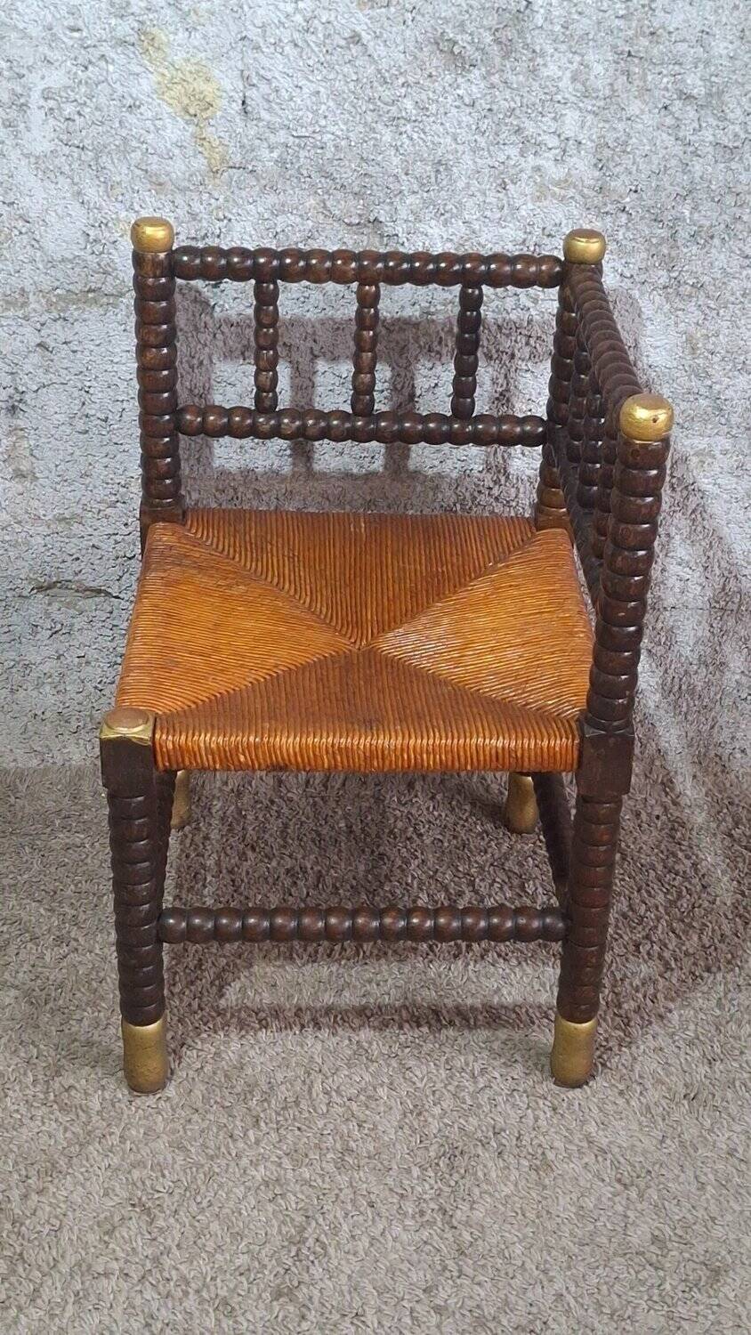 Fireplace corner chair in Louis XIII style, turned wood with braided rush, 19th century.