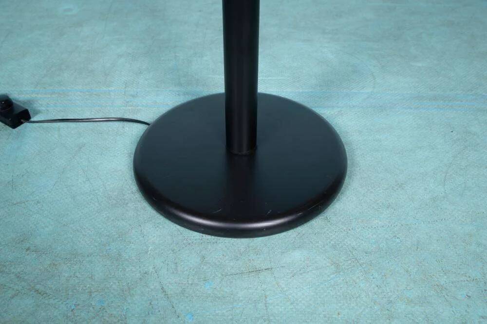 Minimalist floor lamp in glass, space age style.