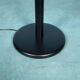 Minimalist floor lamp in glass, space age style.