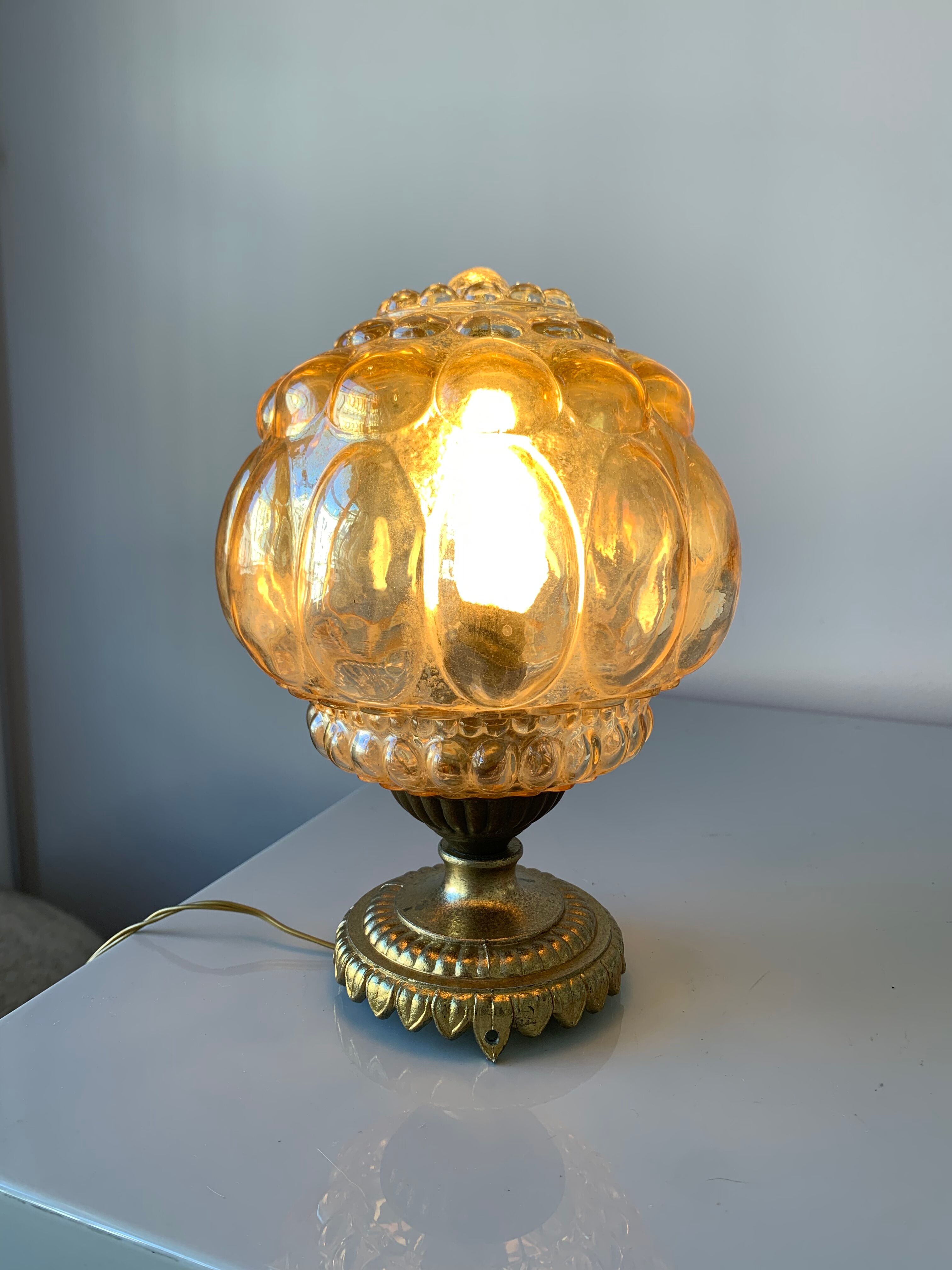 Old vintage table lamp made of amber molded glass