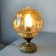 Old vintage table lamp made of amber molded glass