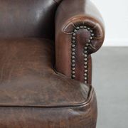 Characterful sheep leather armchair with a beautiful deep colour