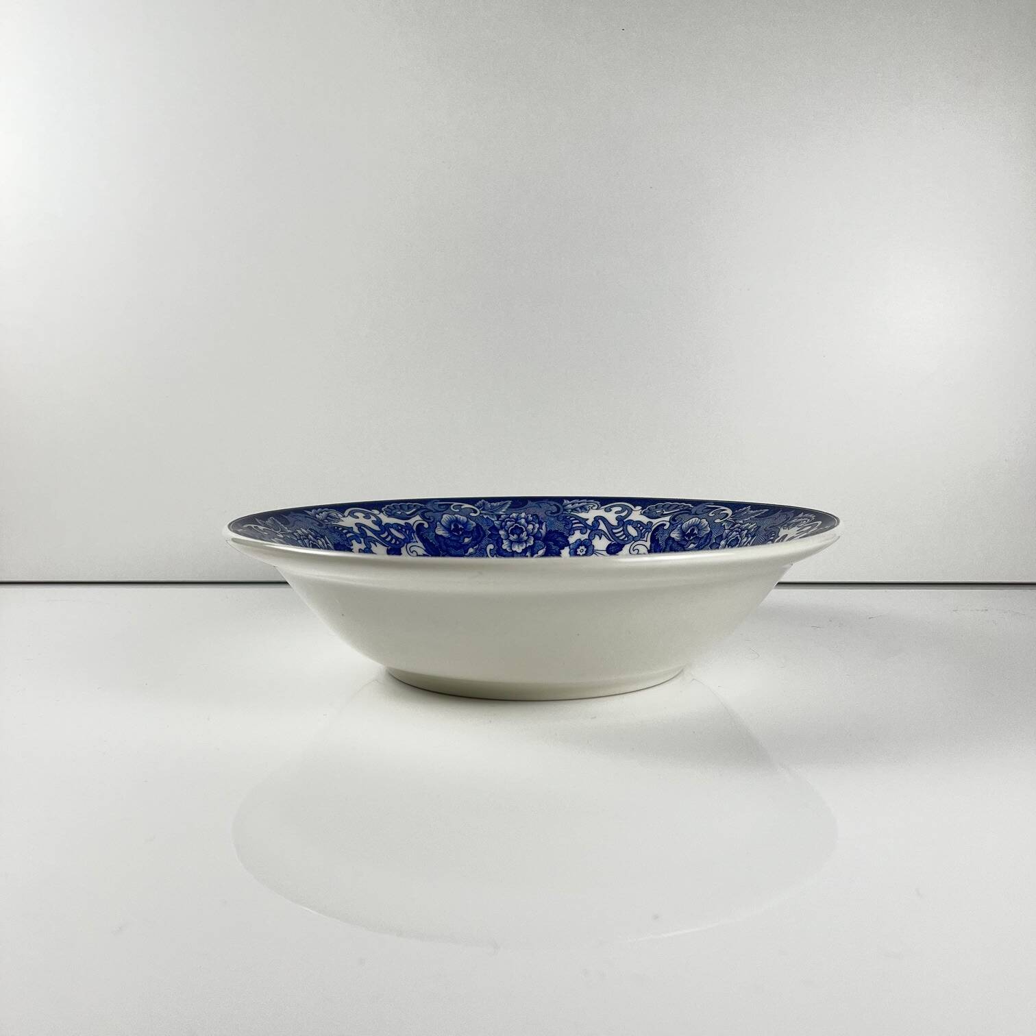 Blue earthenware salad bowl with floral and bird decoration, early 20th century