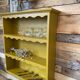 Renovated old saffron wall shelf