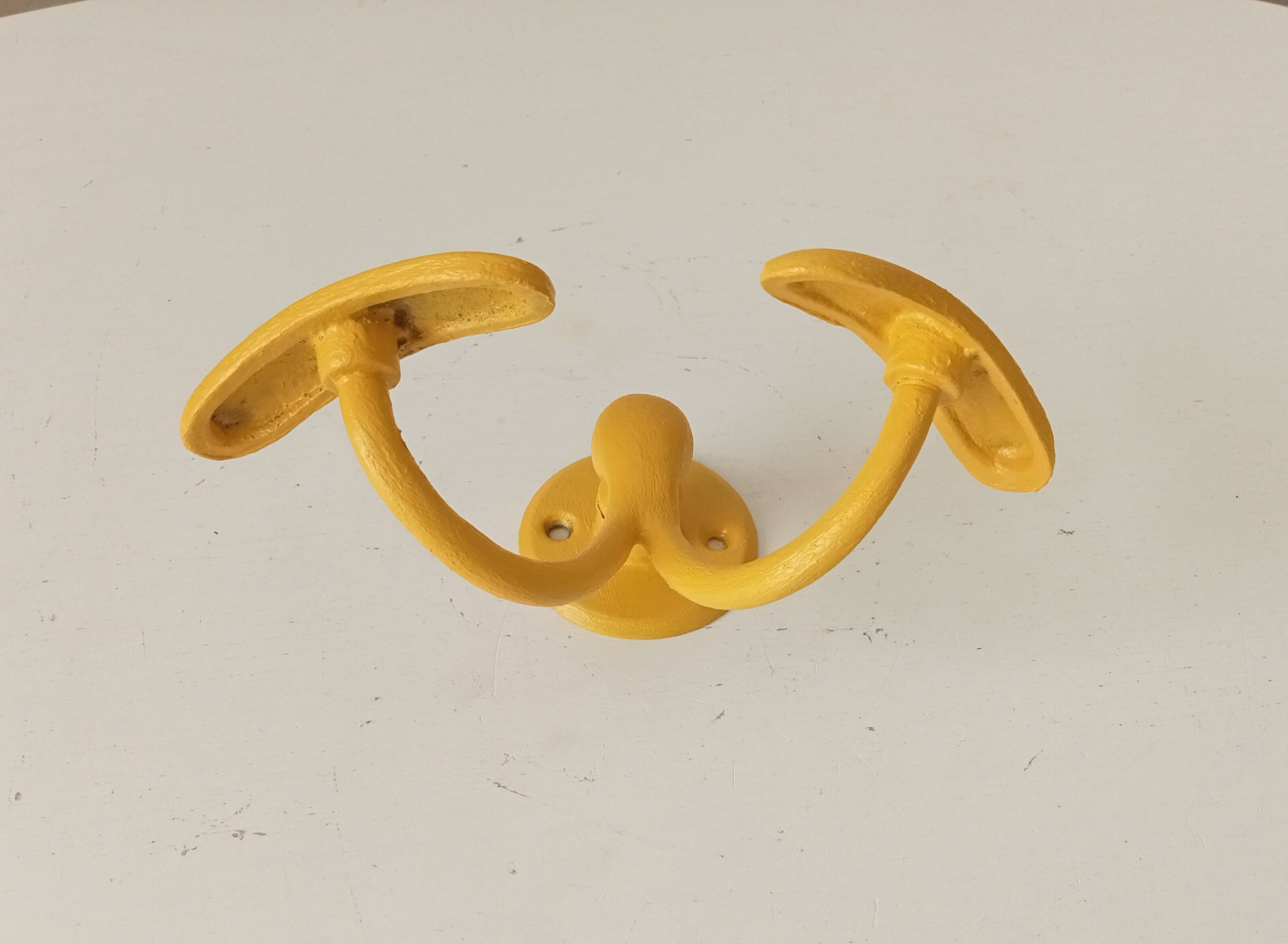 Vintage double coat rack in solid brass