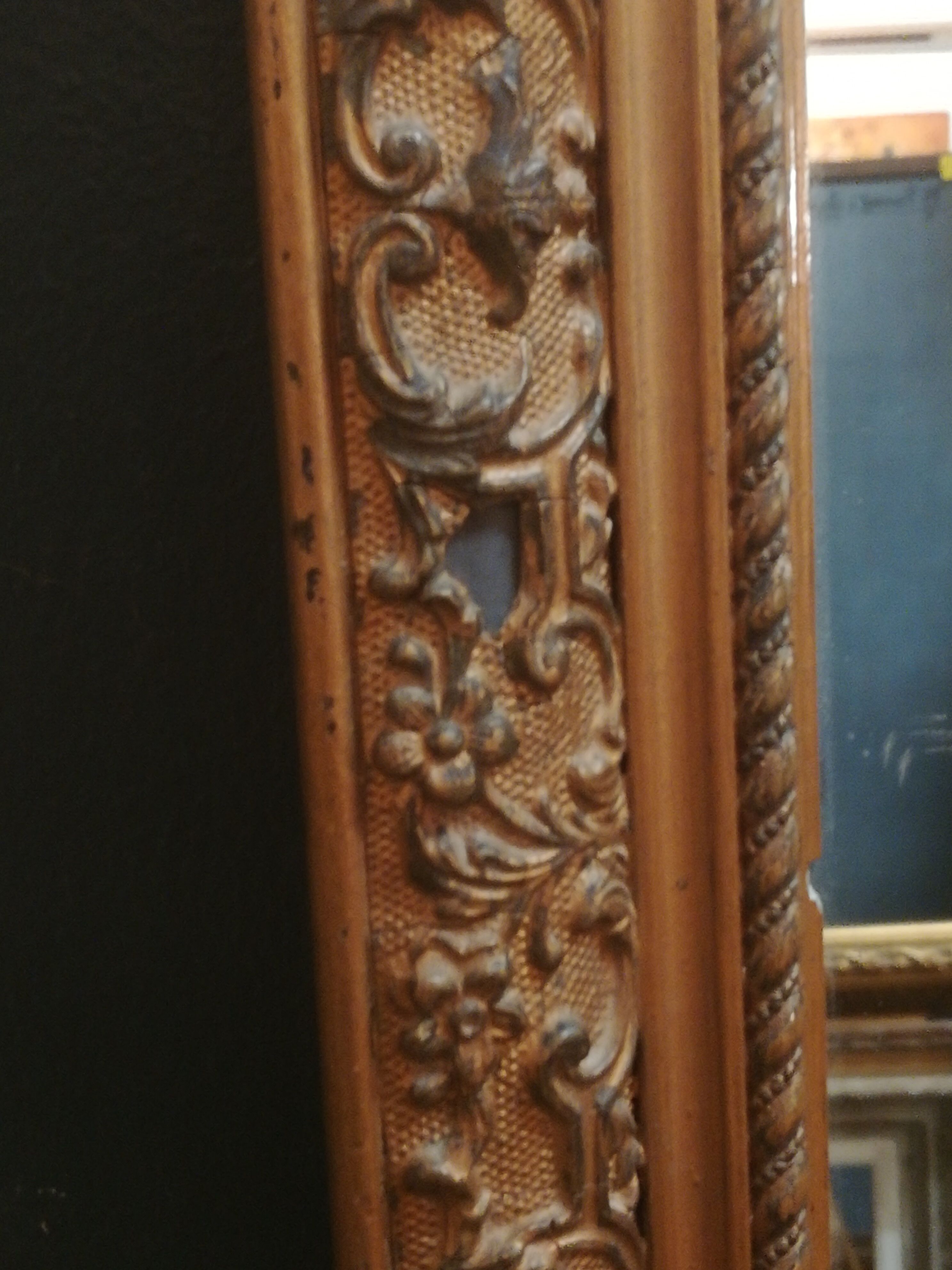 High and narrow mirror in gilded stucco late nineteenth century