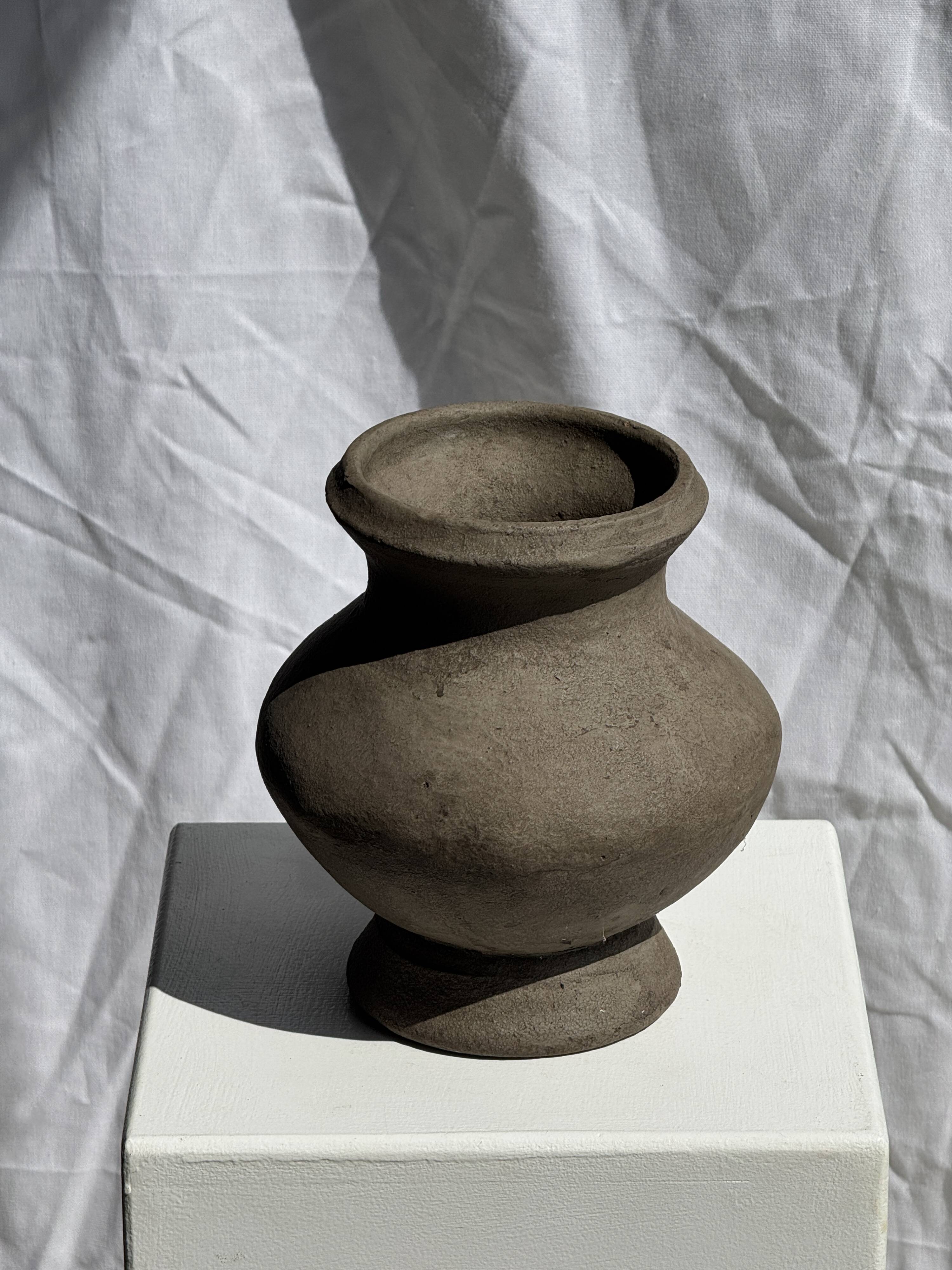 Small brutalist handcrafted terracotta vase with a pedestal, Indonesian, H19 D17.