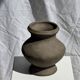 Small brutalist handcrafted terracotta vase with a pedestal, Indonesian, H19 D17.