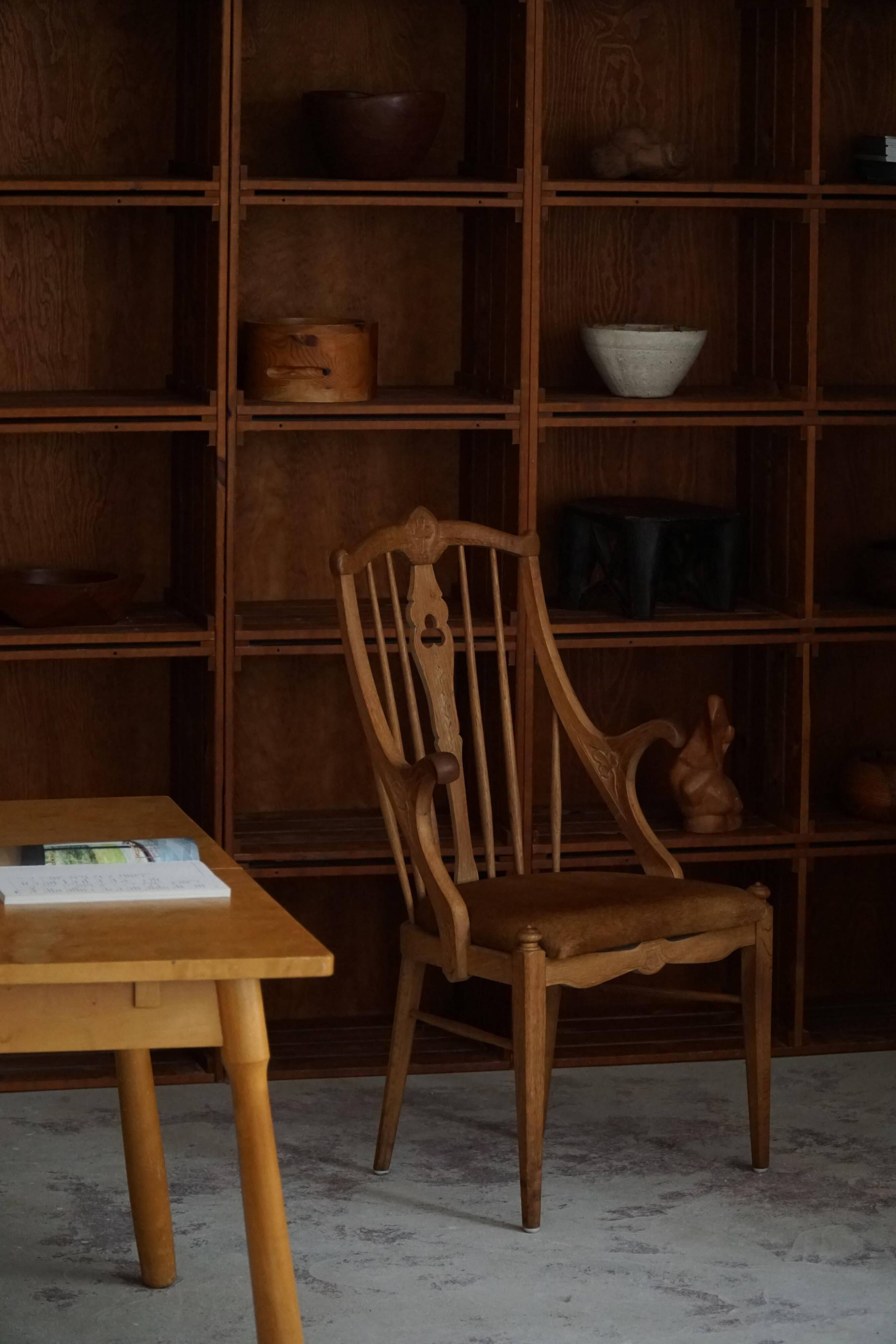 Danish high-back armchair in solid oak with leather cushion, mid-century, 1950s.