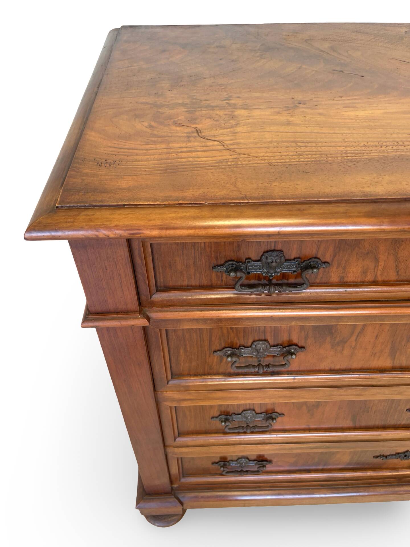 Antique walnut commode with bronze handles in the shape of a lion's mask,