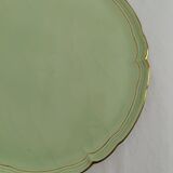 Large pastel green plate with a golden rim.
