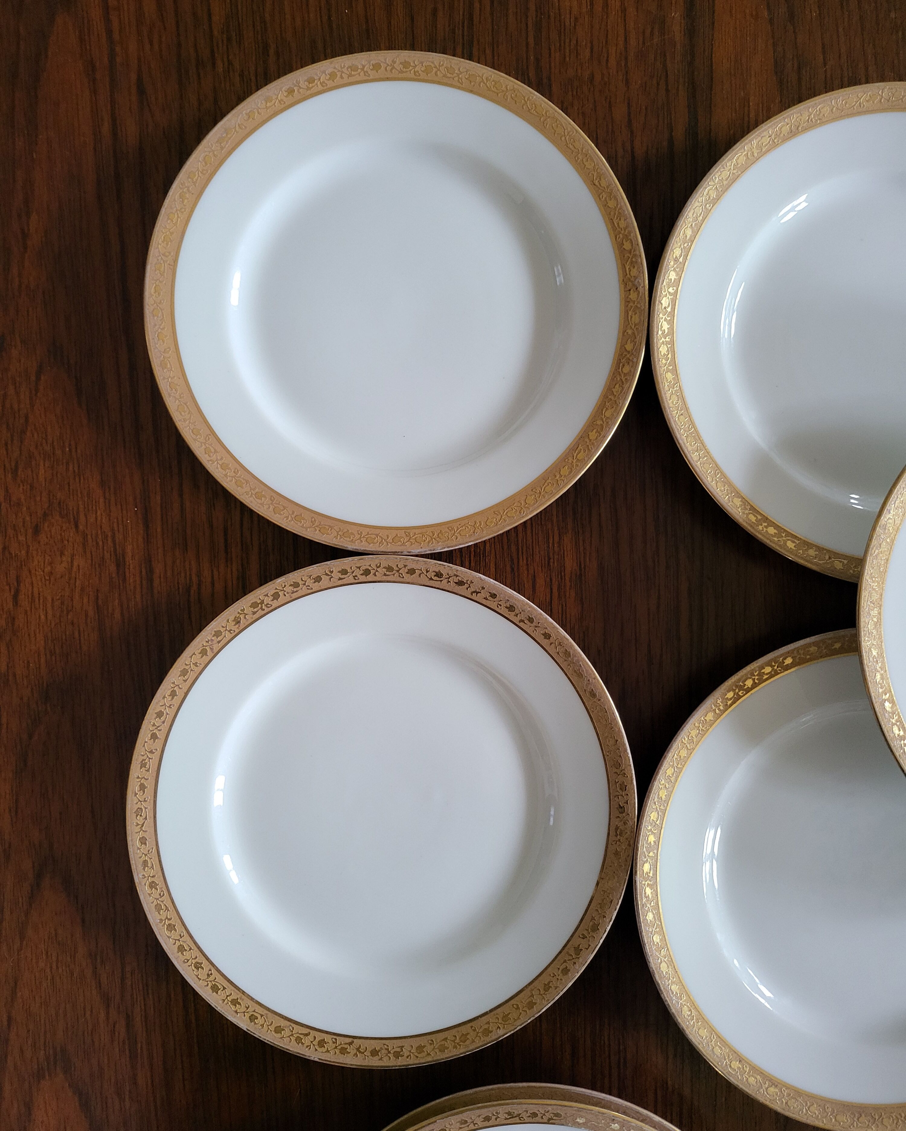 Lot of 8 small porcelain bread plates.