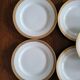 Lot of 8 small porcelain bread plates.